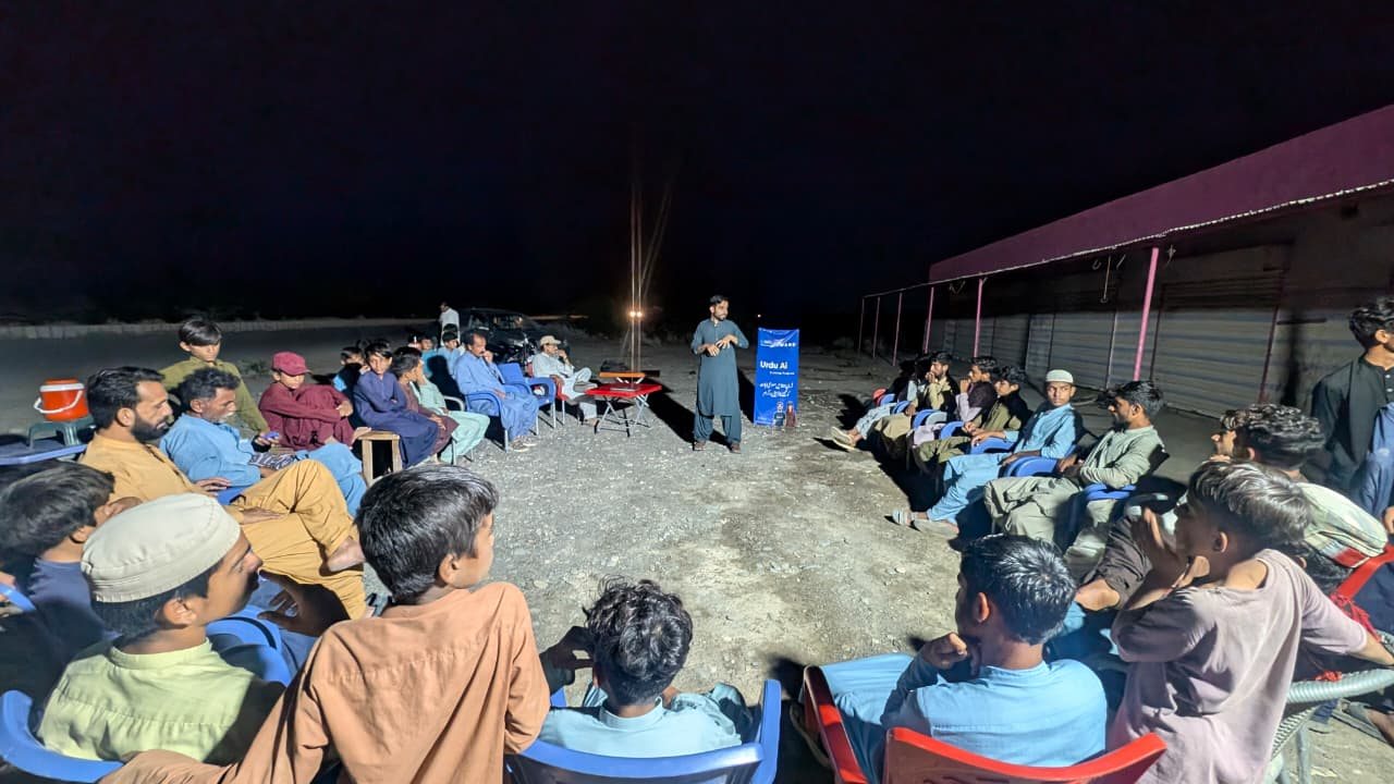 Urdu Ai community learning session held outdoors at night