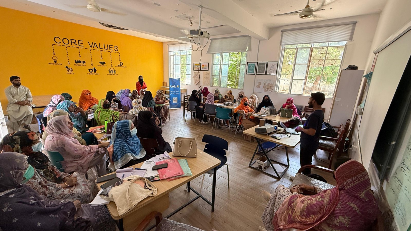 Women educators participating in an Urdu Ai learning session