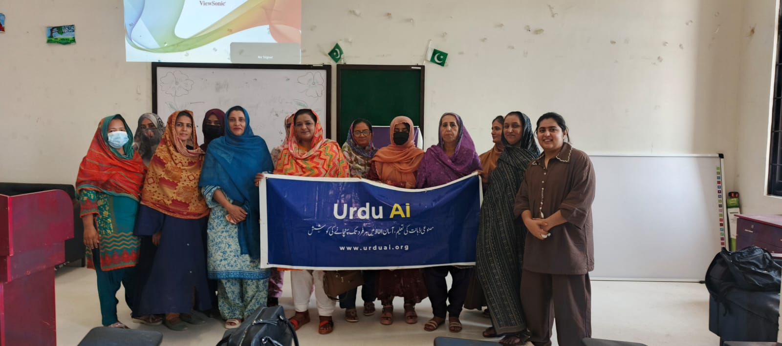 Women standing together after an Urdu Ai training session
