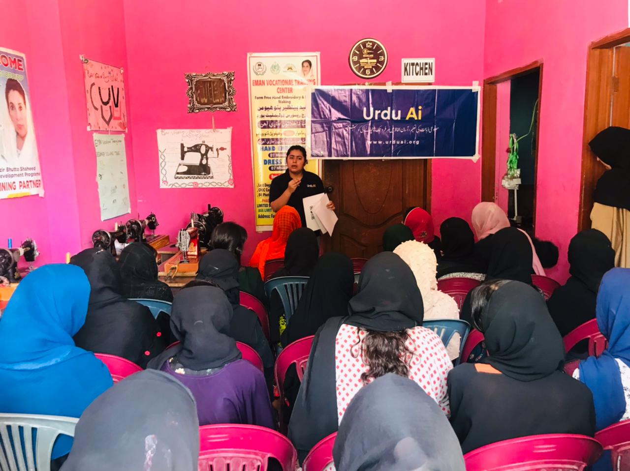 Women attending an Urdu Ai session in a vocational learning space